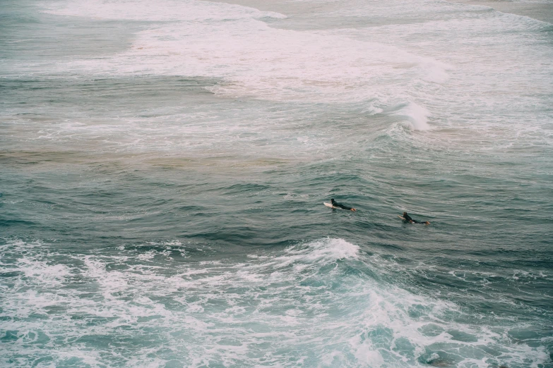 a man riding a wave on top of a surfboard, pexels contest winner, two male, birds eye, beach aesthetic, ocean sprites