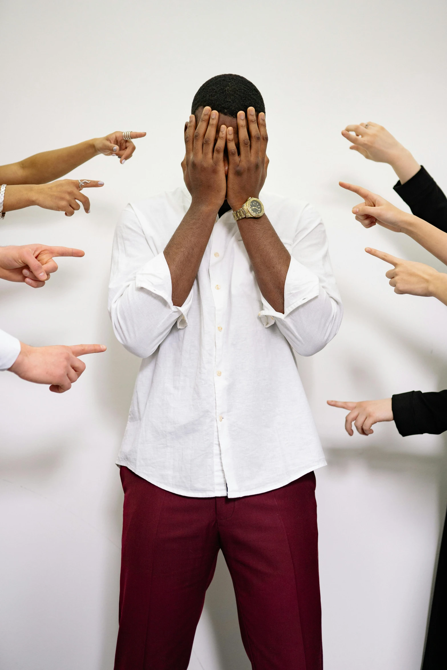 a man standing in front of a group of people, by Nina Hamnett, trending on pexels, renaissance, facepalm, black man, angry and pointing, on grey background