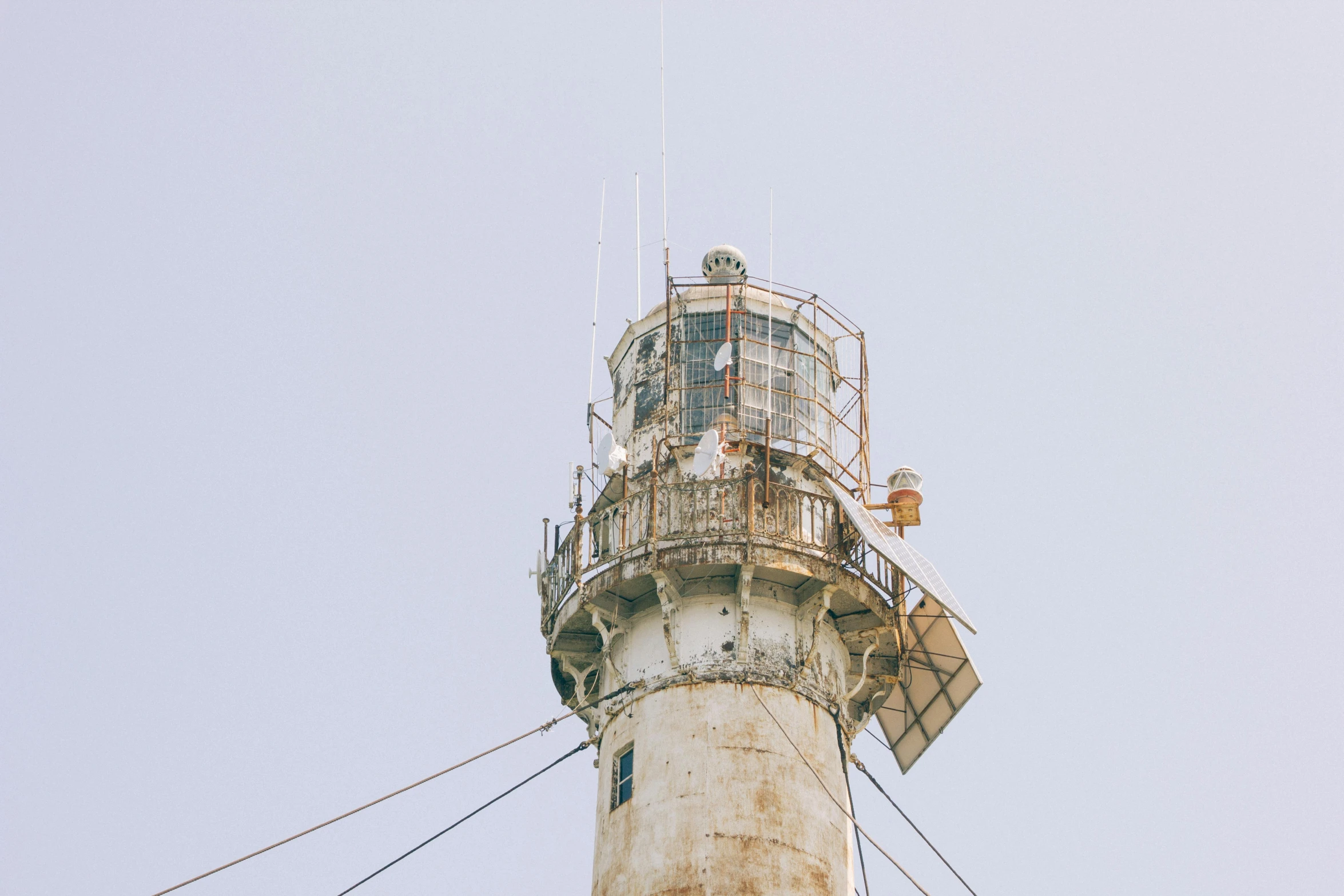 a close up of a light house on a cloudy day, an album cover, unsplash, modernism, scrapyard architecture, maintenance photo, white, shin jeongho