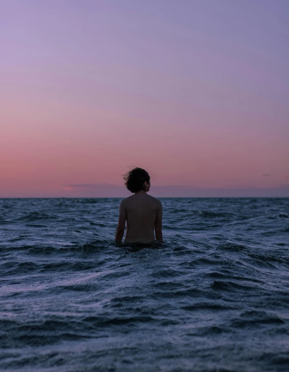 a person sitting in the middle of a body of water, an album cover, unsplash contest winner, lgbtq, predawn, profile image, oceanside