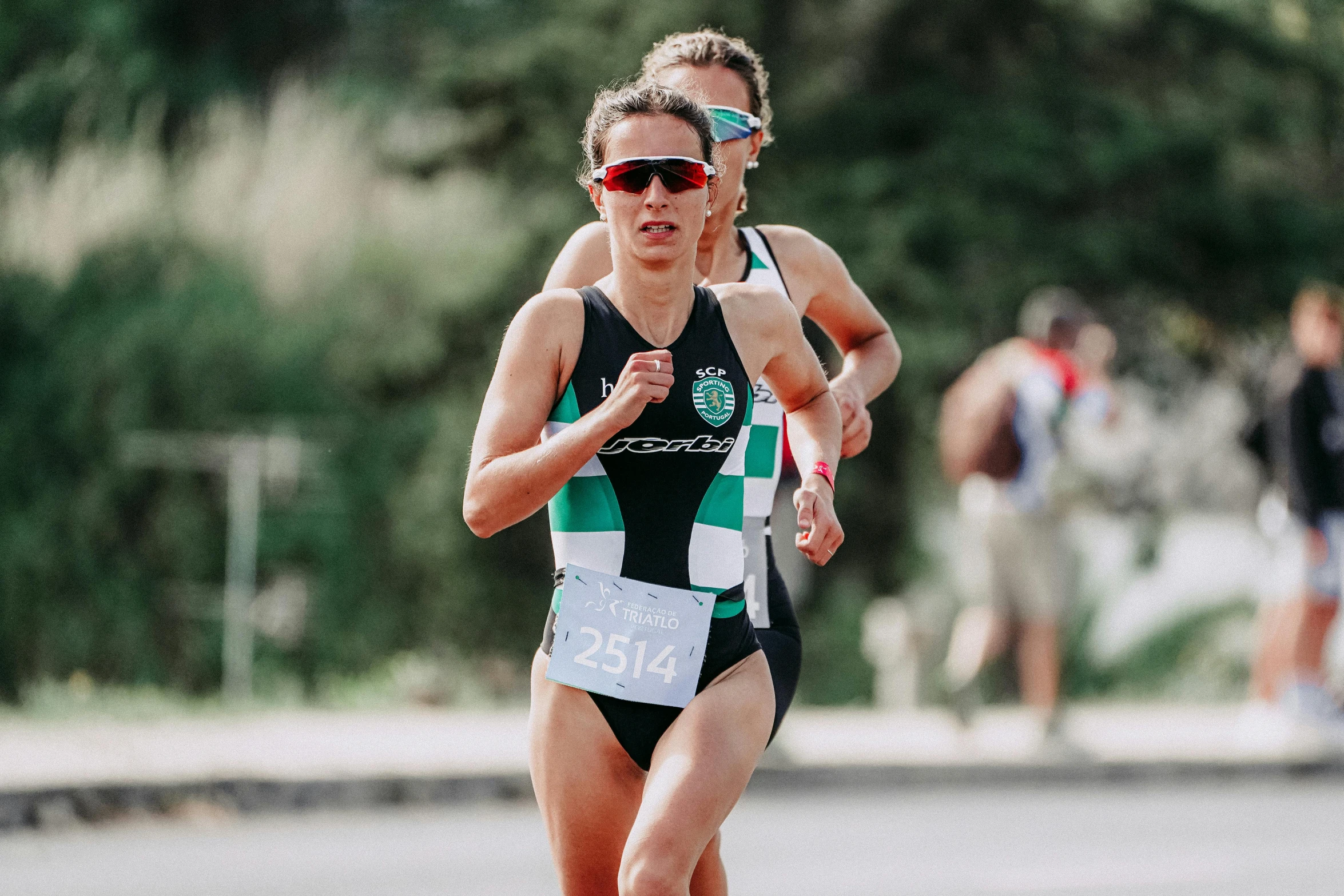 a women who is running in a race, green swimsuit, icaro carvalho, 🚿🗝📝, profile image