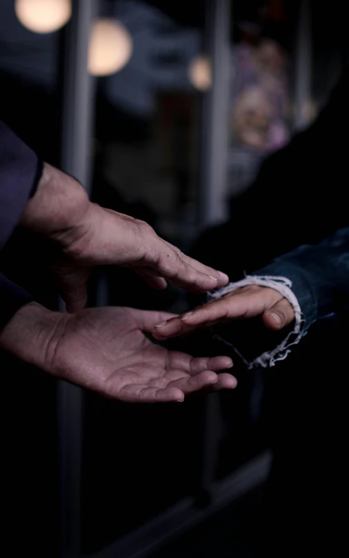 a close up of a person handing something to another person, by Matija Jama, hurufiyya, paul barson, lightly dressed, photographed for reuters, 15081959 21121991 01012000 4k