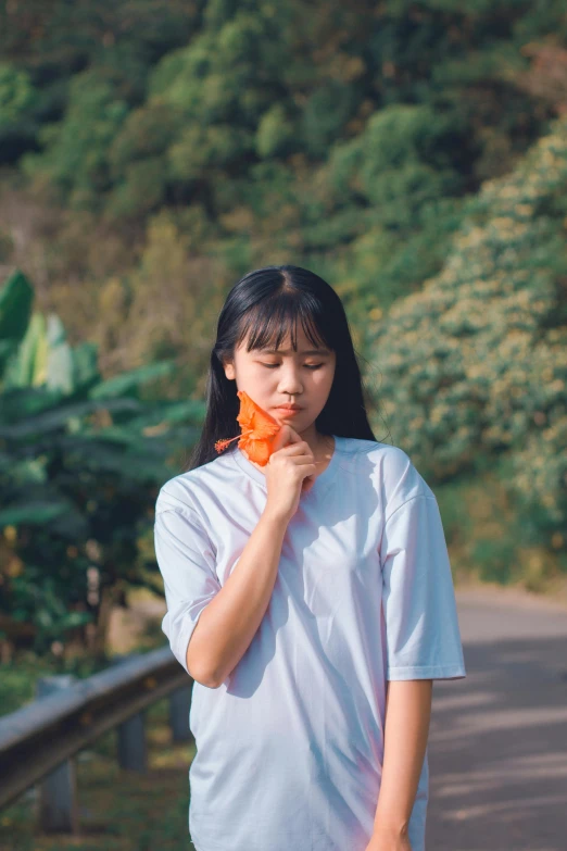 a woman standing on the side of a road, inspired by Kim Jeong-hui, pexels contest winner, realism, wearing an orange t shirt, frilled blooming collar, eating ice - cream, profile image