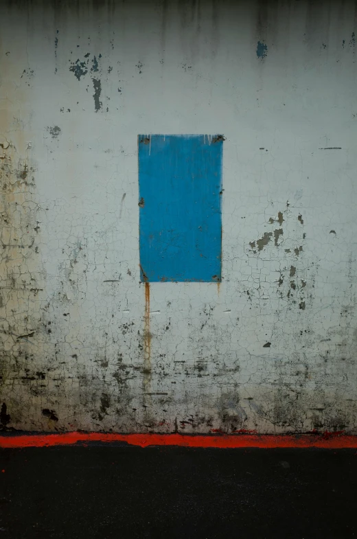 a red fire hydrant sitting in front of a white wall, a minimalist painting, inspired by Nicolas de Staël, flickr, ((blue)), oil on aged tin, location ( favela _ wall ), paul barson