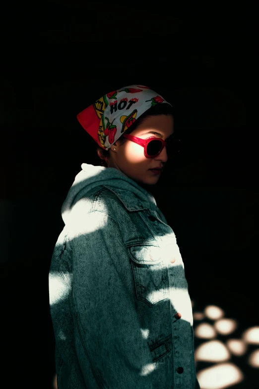 a woman wearing sunglasses and a head scarf, inspired by Elsa Bleda, trending on pexels, back lit, red cap, androgynous person, ilustration