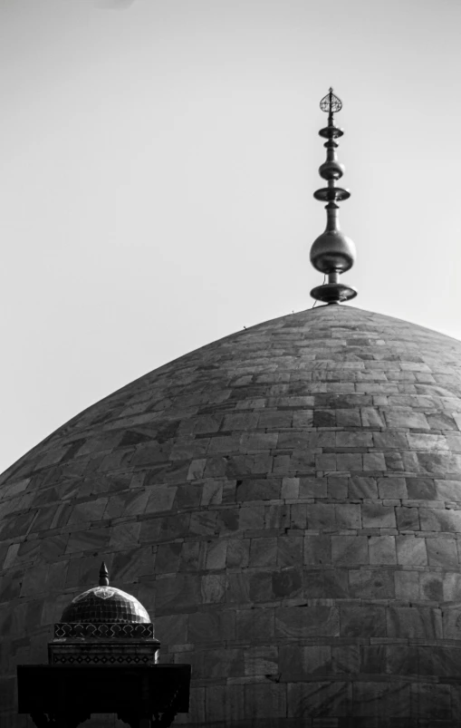 a black and white photo of a dome with a cross on top, by Ahmed Yacoubi, trending on unsplash, arabesque, tiled roofs, 2 5 6 x 2 5 6, a wooden, tombs