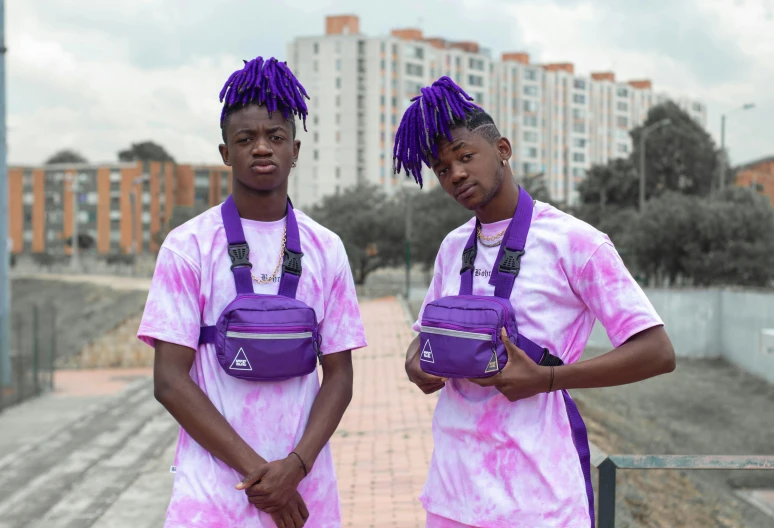 a couple of young men standing next to each other, an album cover, by Charly Amani, pexels, purple outfit, bags, avatar image, two pigtails hairstyle