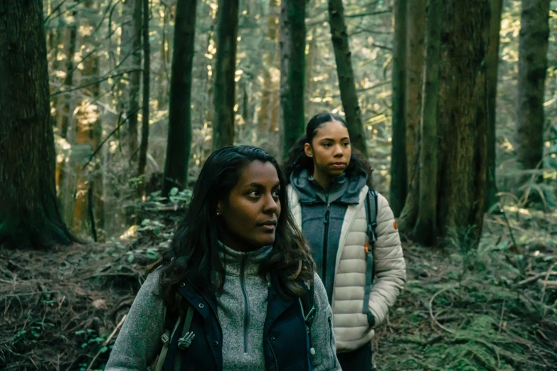 a couple of people walking through a forest, a portrait, tessa thompson, haida gwaii, two women, tv still