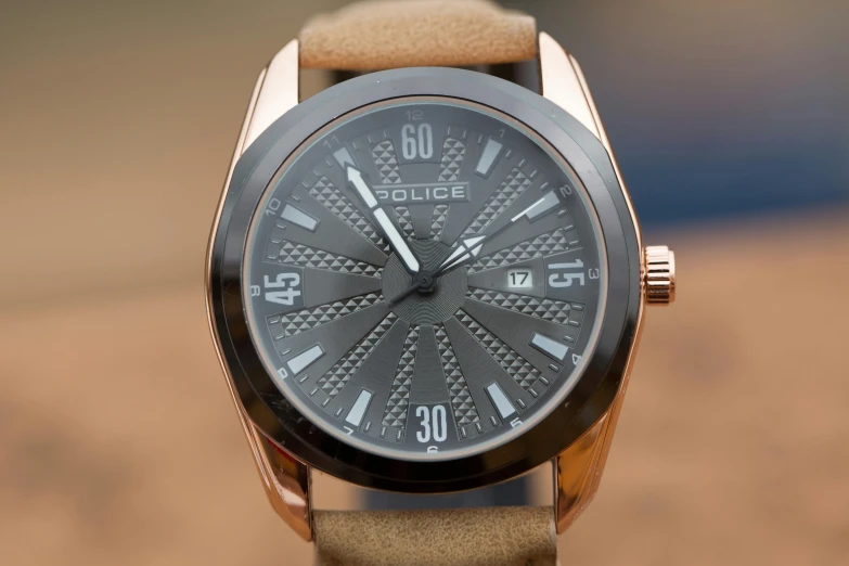 a close up of a watch on a table, a stipple, by Bradley Walker Tomlin, pexels contest winner, op art, police, metallic bronze skin, fierce expression 4k, full front view