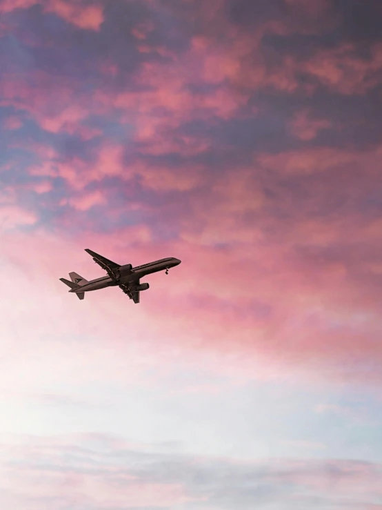 a large jetliner flying through a cloudy sky, by Carey Morris, pexels contest winner, pink cloudy background, profile image, thumbnail, 🚿🗝📝