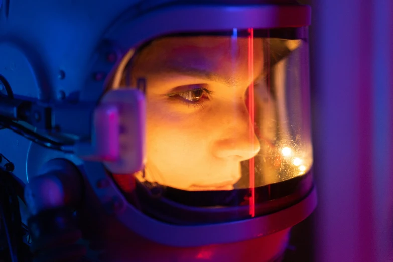 a close up of a person in a space suit, a portrait, by Adam Marczyński, pexels contest winner, stood in a lab, inner glow, close face view, nasa and roscosmos