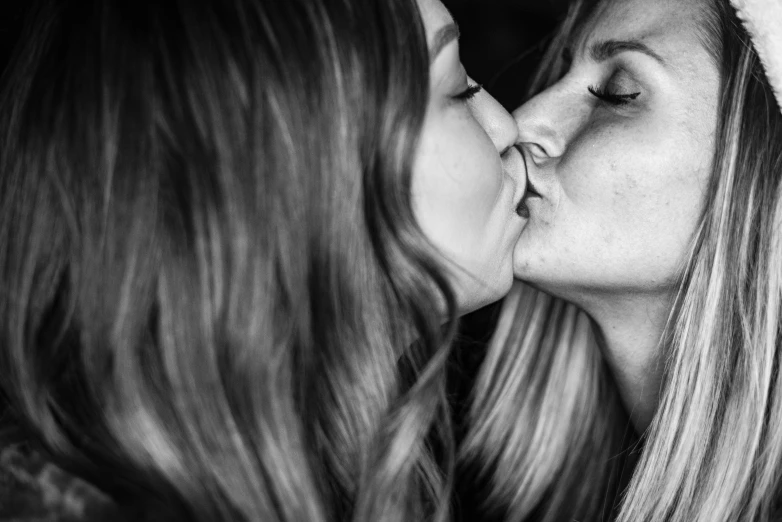 a couple of women that are kissing each other, a black and white photo, by Caroline Mytinger, unsplash, tachisme, 1024x1024, shot on sony a 7 iii, lesbians, super realistic”