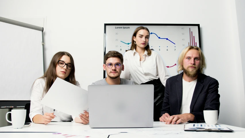 a group of people sitting around a table with a laptop, on a white table, professional advertisement, profile image, trending photo