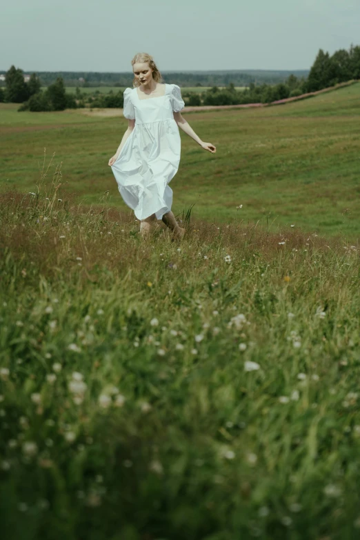 a woman in a white dress running through a field, unsplash, renaissance, live-action archival footage, on a green hill, ignant, little bo peep