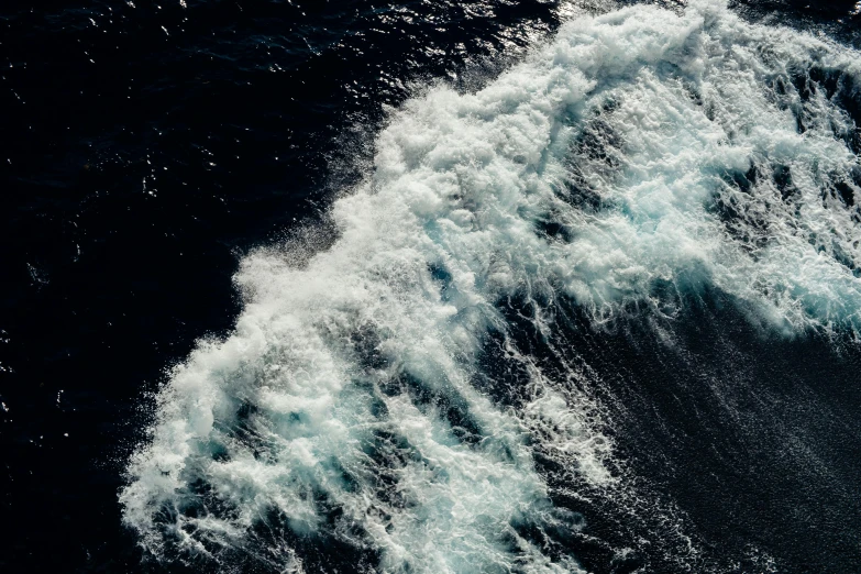 a man riding a wave on top of a surfboard, pexels, hurufiyya, deep texture, thumbnail, ocean spray, water surrounds the ship