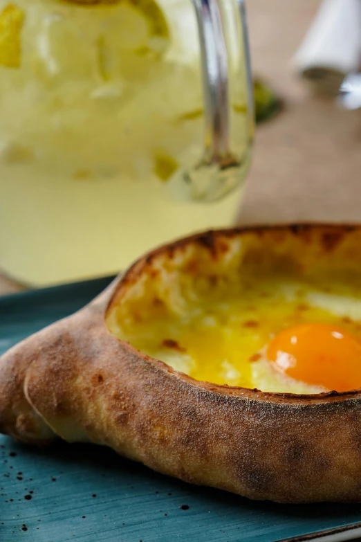 a close up of a plate of food on a table, inspired by Géza Dósa, an egg, crust, hasbulla magomedov, drink