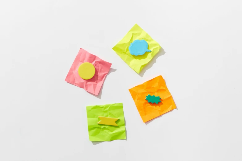 a bunch of sticky notes sitting on top of each other, inflateble shapes, chartreuse and orange and cyan, 1450, product shot