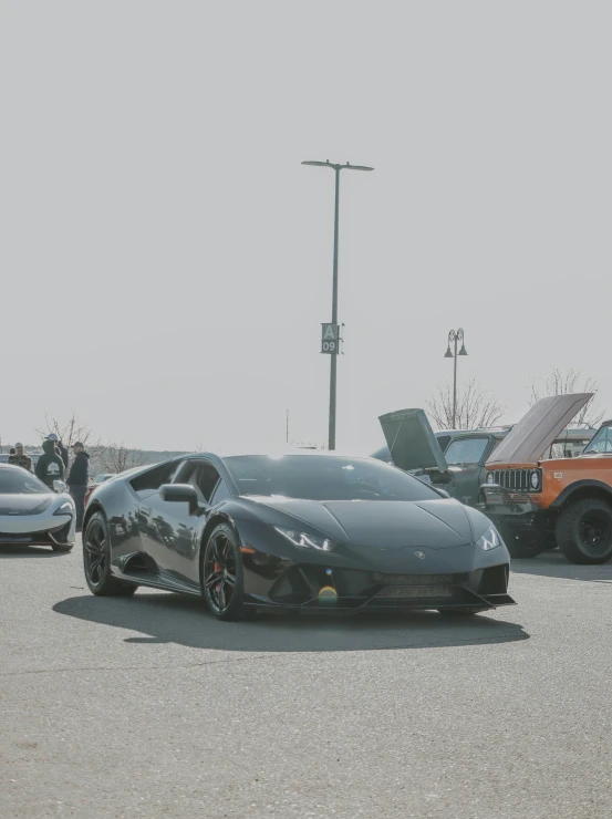 a black sports car parked in a parking lot, by Ryan Pancoast, ultra 4k, bold lamborghini style, in formation, on display
