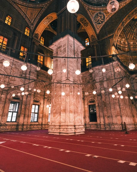 the inside of a large building with a red carpet, hurufiyya, holy lights, trending on, fan favorite, minarets