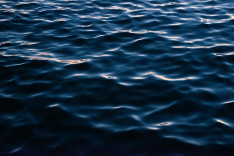 a close up of a body of water, inspired by Elsa Bleda, unsplash, midnight blue, shot on hasselblad, vapourwave, calm evening