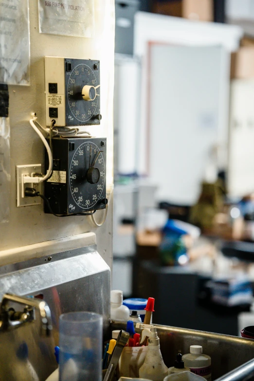 a kitchen filled with lots of clutter and clutter, by Daniel Lieske, unsplash, inside of a 1970s science lab, door to lab, drooling ferrofluid. dslr, sunny environment