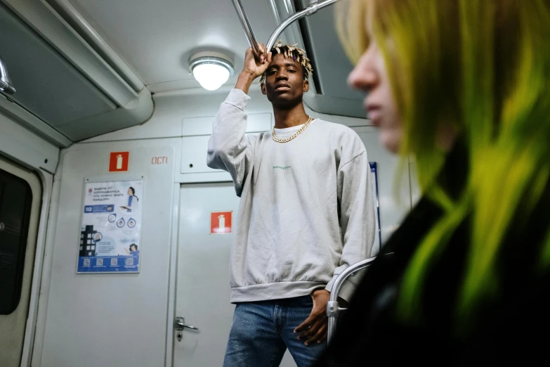 a man standing on top of a train next to a woman, trending on unsplash, realism, playboi carti portrait, bleached, thin young male, federation clothing