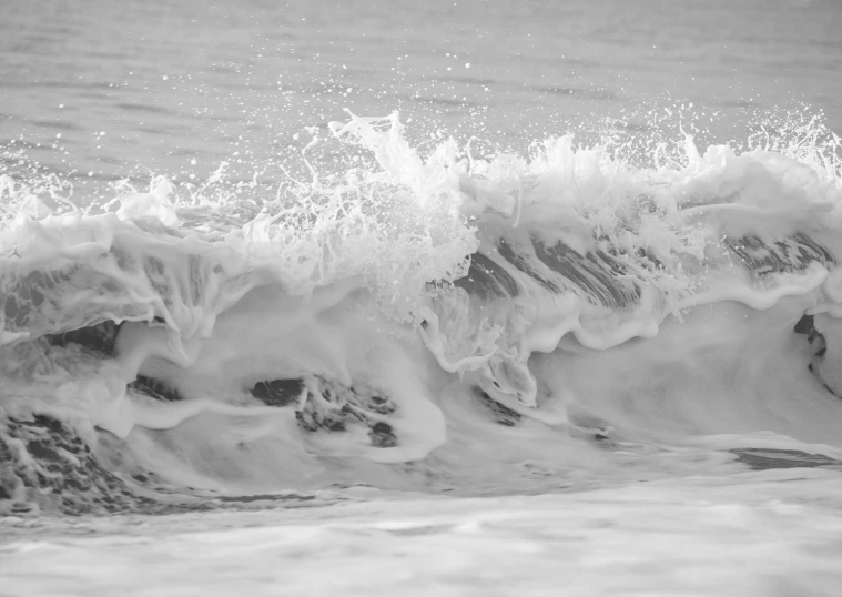 a man riding a wave on top of a surfboard, a black and white photo, by Jan Kupecký, pexels, fine art, crashing waves and sea foam, abstract white fluid, highly detailded', windy beach