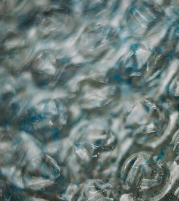 a close up of a glass filled with water, a photorealistic painting, inspired by Vija Celmins, unsplash, dynamic pearlescent teal light, ( ( abstract ) ), ignant, currents