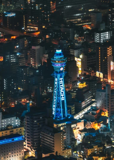 an aerial view of a city at night, by Niko Henrichon, unsplash contest winner, graffiti, japan tokyo skytree, medium closeup shot, “the ultimate gigachad, blue