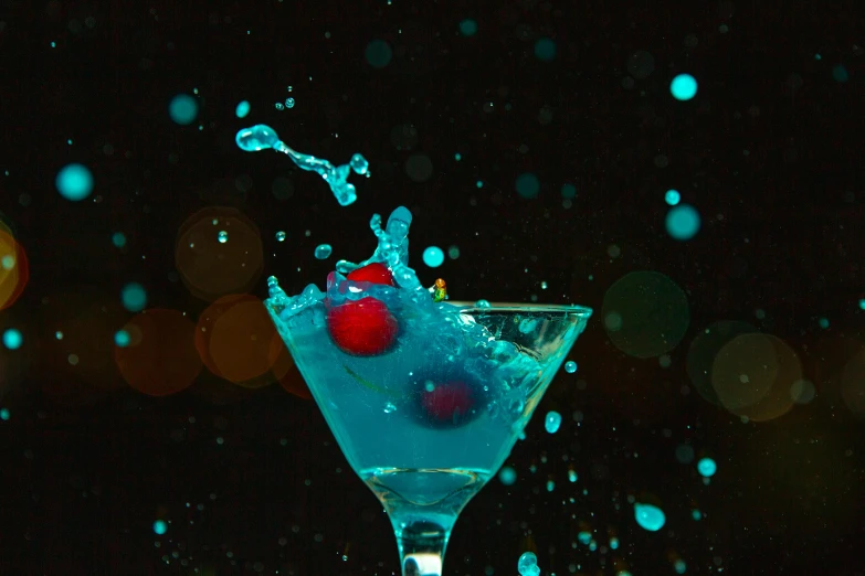 a martini glass filled with blue liquid and garnished with cherries, by Ndoc Martini, pexels, teal lights, avatar image, ecstatic, thumbnail