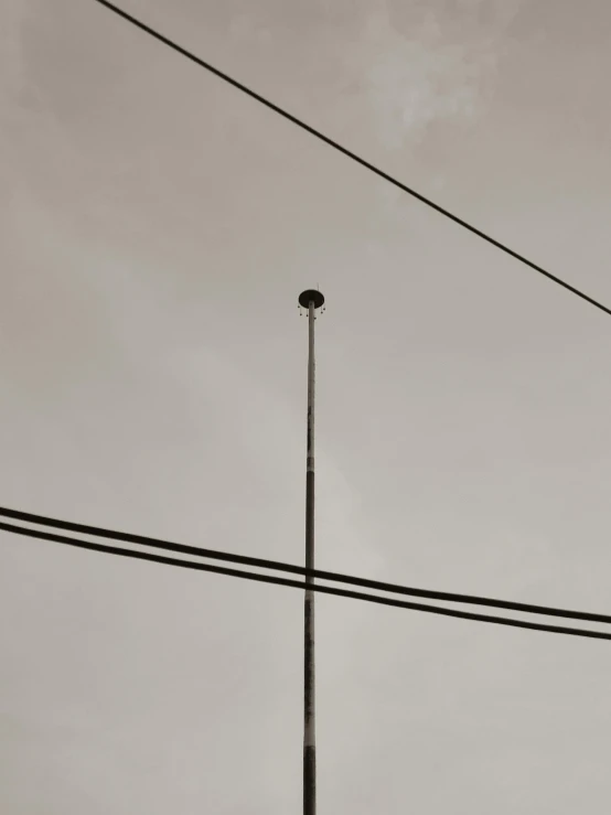 a black and white photo of a street light, an album cover, inspired by Alexander Rodchenko, unsplash, postminimalism, loose wires, brown, ignant, 2019 trending photo
