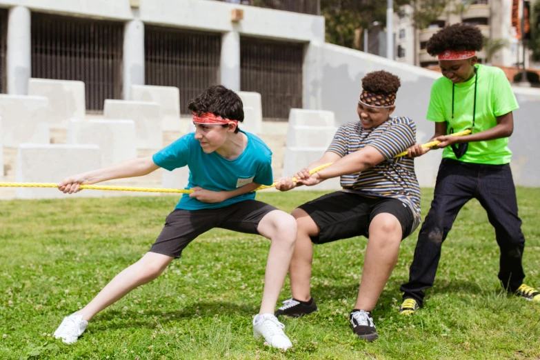 a group of young men playing tug - rope in a park, pexels contest winner, renaissance, long bow and arrows, andy milonakis, avatar image, in an action pose