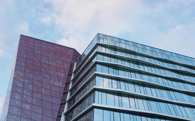 a couple of tall buildings next to each other, by Konrad Witz, unsplash, modernism, glass wall, payne's grey and venetian red, three - quarter view, commercial