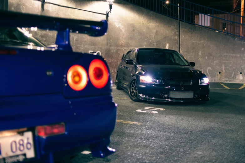 two cars parked in a parking lot at night, a portrait, inspired by An Gyeon, unsplash, nissan gtr r 3 4, avatar image