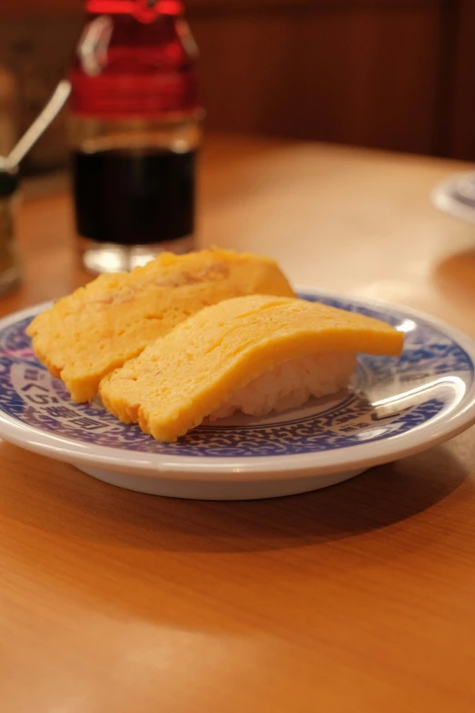 a close up of a plate of food on a table, by Eizan Kikukawa, sponge, けもの, cheddar, traditional medium