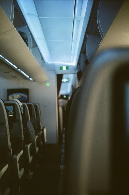 a row of empty seats in an airplane, pexels contest winner, facing away from camera, soft glow, thumbnail, **cinematic