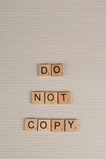 the words do not copy spelled in scrabbles, a photocopy, unsplash, 2 5 6 x 2 5 6 pixels, a wooden, crypto, cover corp