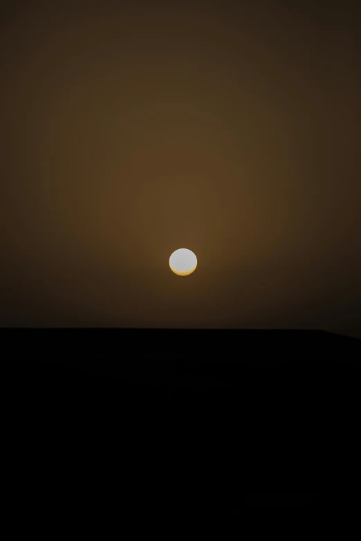 the sun is setting in the dark sky, by Attila Meszlenyi, minimalism, oman, white moon and black background, tatooine, 2010s