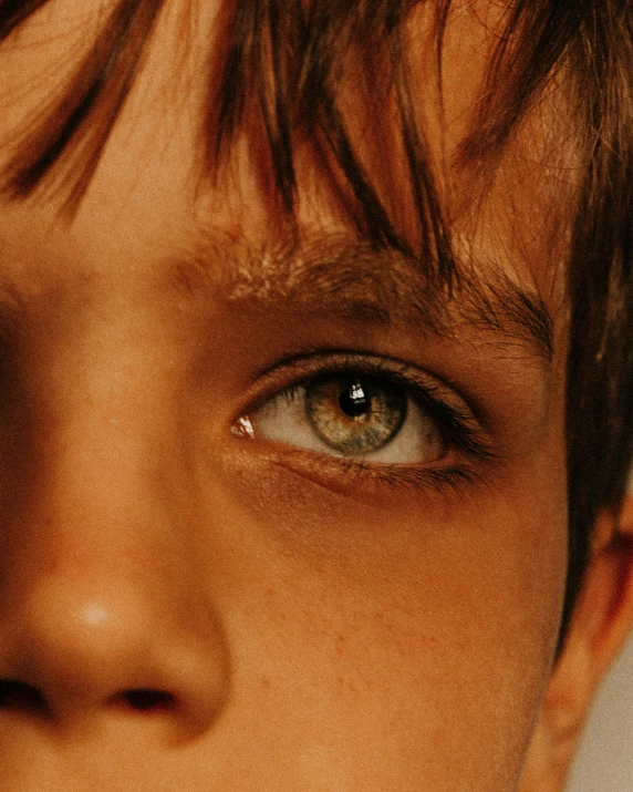 a close up of a person with a tie on, an album cover, trending on unsplash, hyperrealism, rainbow eyes, young boy, eye color green, ignant