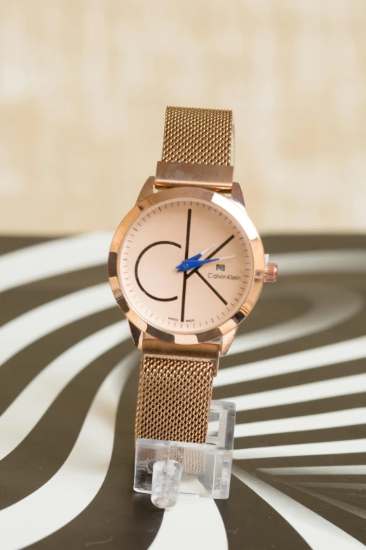 a close up of a watch on a table, an album cover, inspired by Charles Roka, rose gold, cosmopolitan, kek, thumbnail