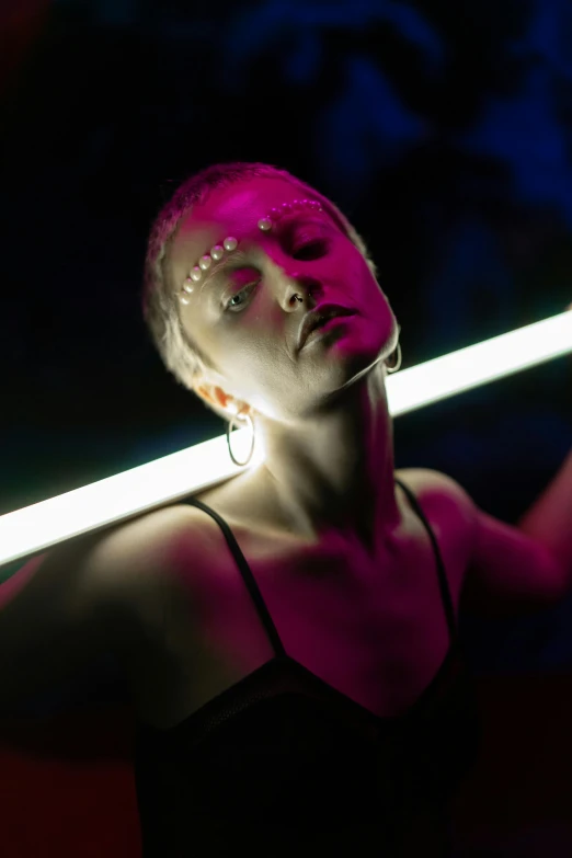 a woman in a black dress holding a neon sword, a portrait, unsplash, light and space, skin made of led point lights, profile image, trending photo