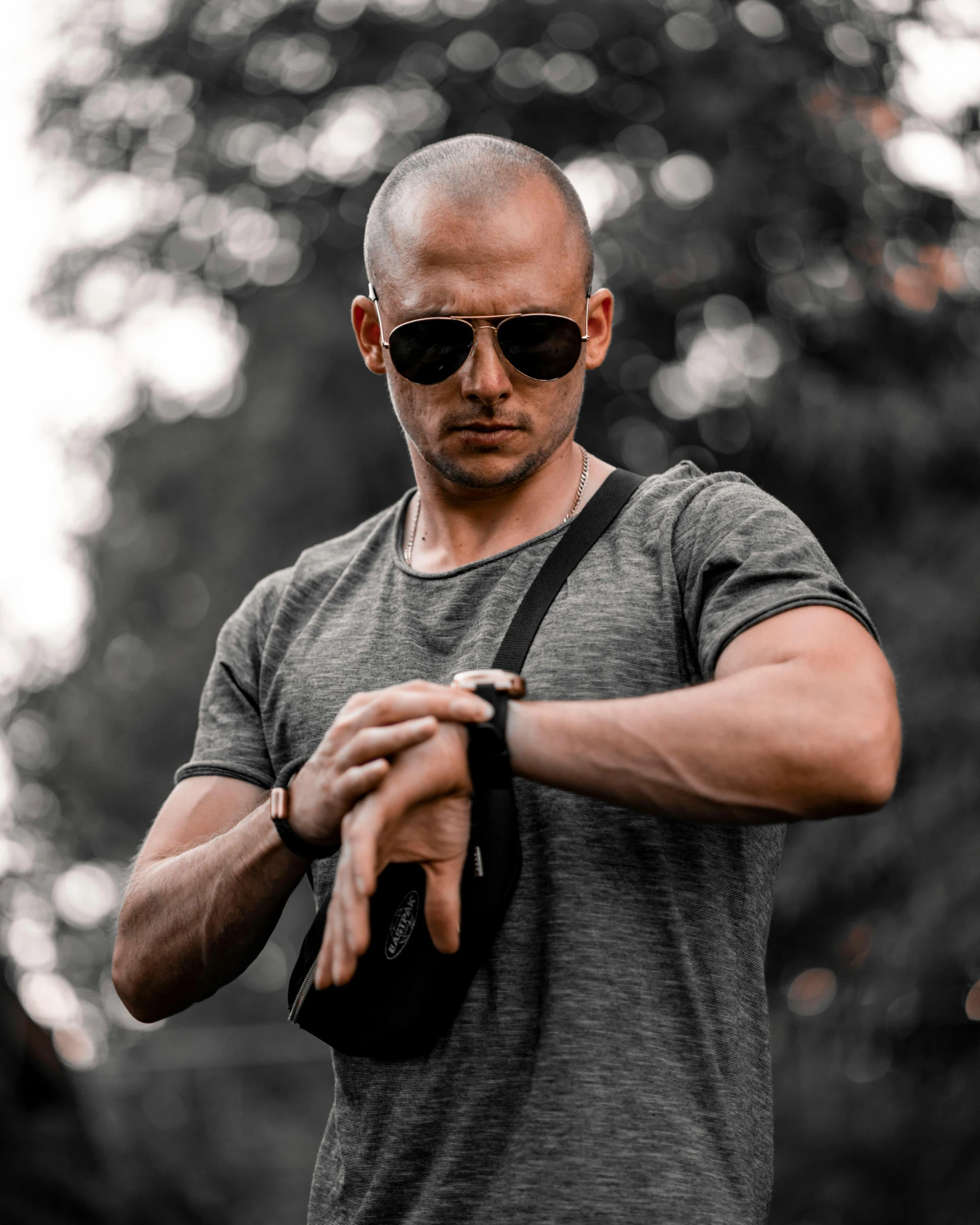 a man in sunglasses is looking at his watch, inspired by Daryush Shokof, buzz cut, holding pdw, profile image, dark photo