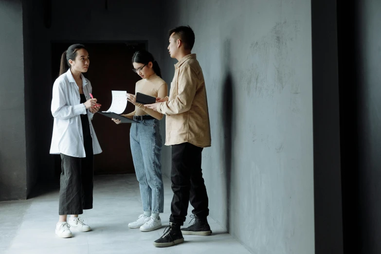 a group of people standing next to each other, pexels contest winner, visual art, doctors office, holding a clipboard, architect, ignant