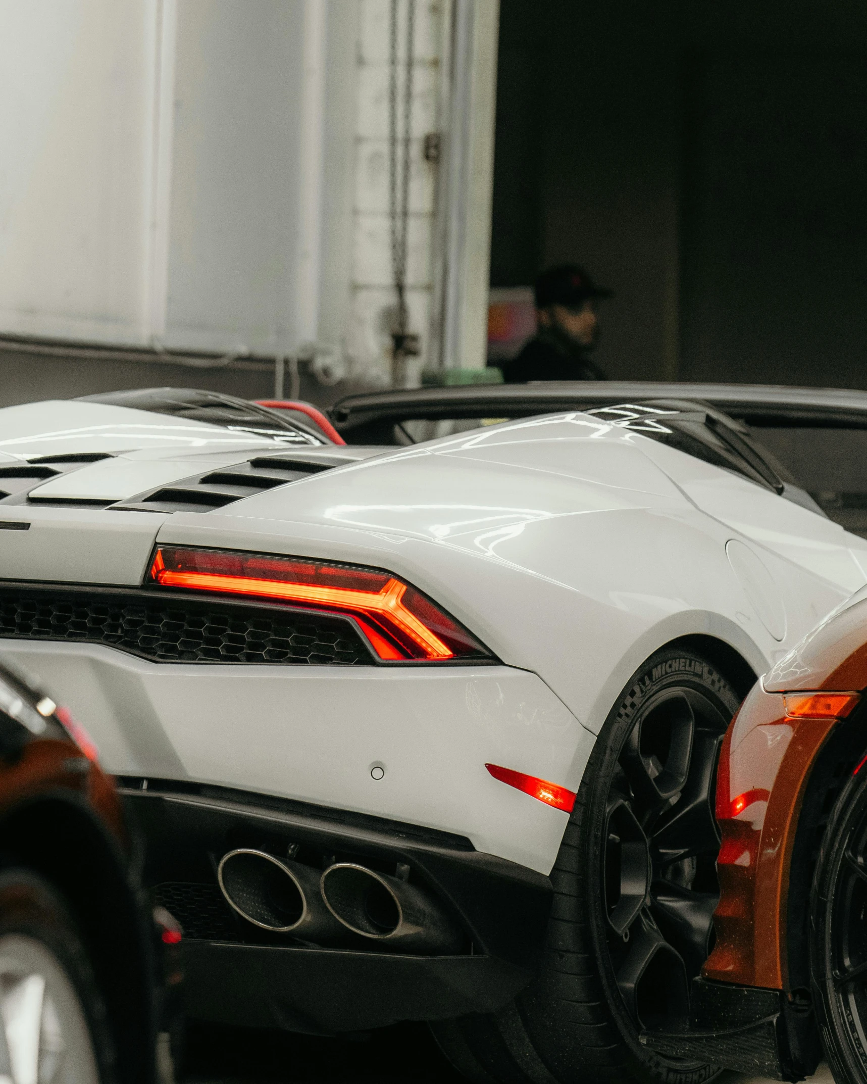 a couple of white sports cars parked next to each other, pexels contest winner, lamborghini, back light, inspect in inventory image, thumbnail