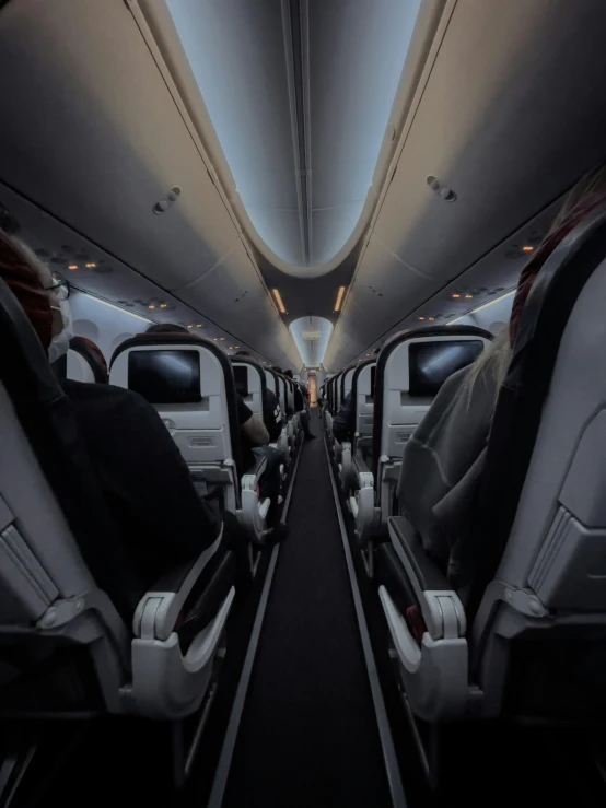 the inside of an airplane with rows of seats, an album cover, unsplash contest winner, renaissance, dark vibes, ( ( theatrical ) ), on the runway, profile image