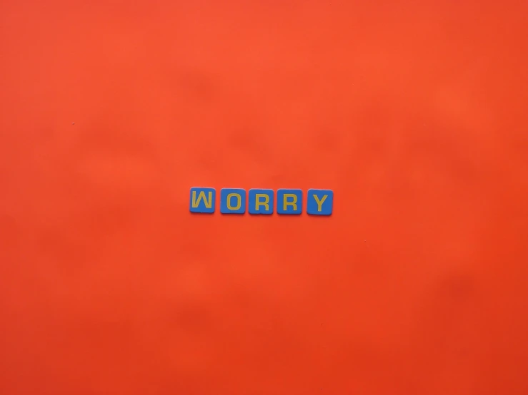 the word worry spelled in blue letters on a red background, an album cover, by Derek Jarman, rex orange county, calm weather, claymation style, very orange