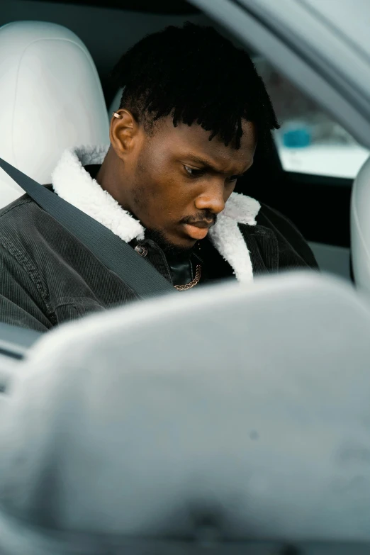 a man sitting in the passenger seat of a car, trending on pexels, playboi carti, disappointed, grayish, thick lining