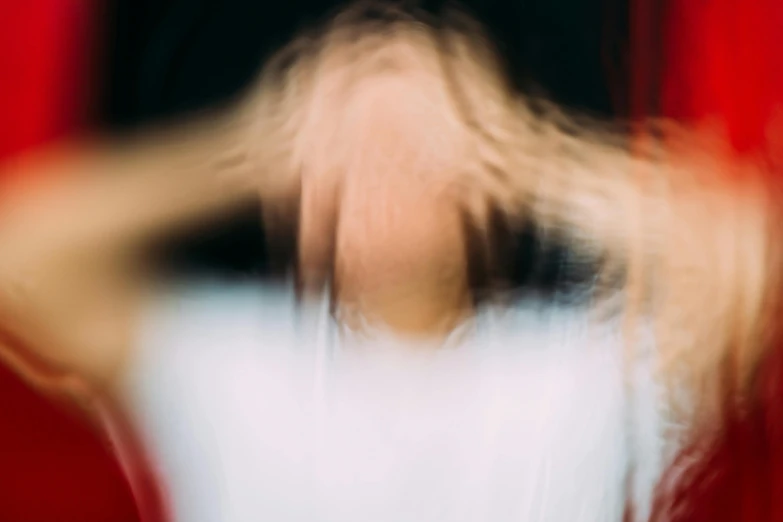 a blurry photo of a woman with blonde hair, by Jan Rustem, trending on unsplash, abstract illusionism, slightly red, terrified, thinning hair, faceless people