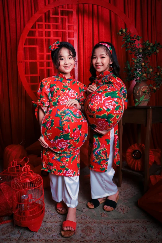 a couple of women standing next to each other, inspired by Gao Kegong, happening, pregnancy, wearing festive clothing, promotional image, kids