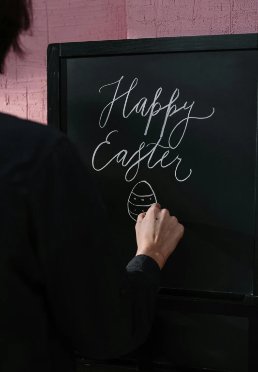 a woman writing happy easter on a blackboard, chalk art, by Joseph Badger, trending on unsplash, detail shot, digital matte black paper art, thumbnail, 1 6 x 1 6